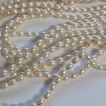 5*7мм Овал кераміка св.беж, довжина 80 см (115-120шт) 0400-002 фото